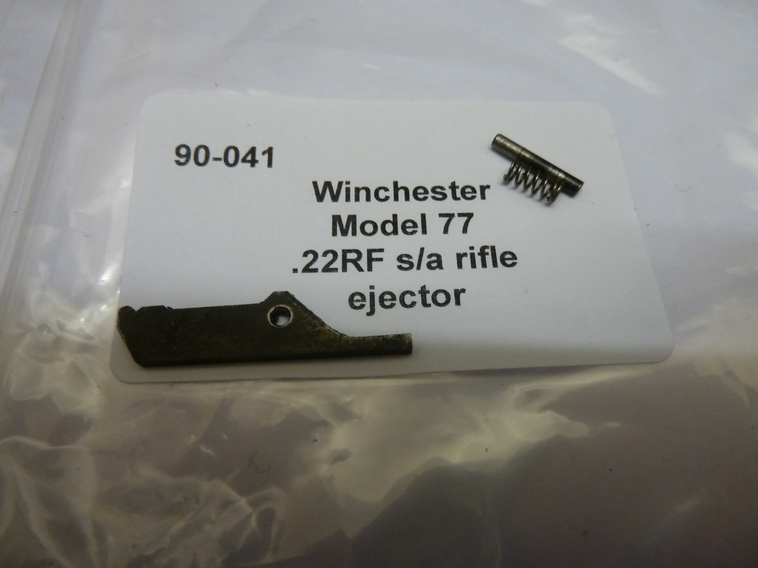 Winchester 77 rifle ejector